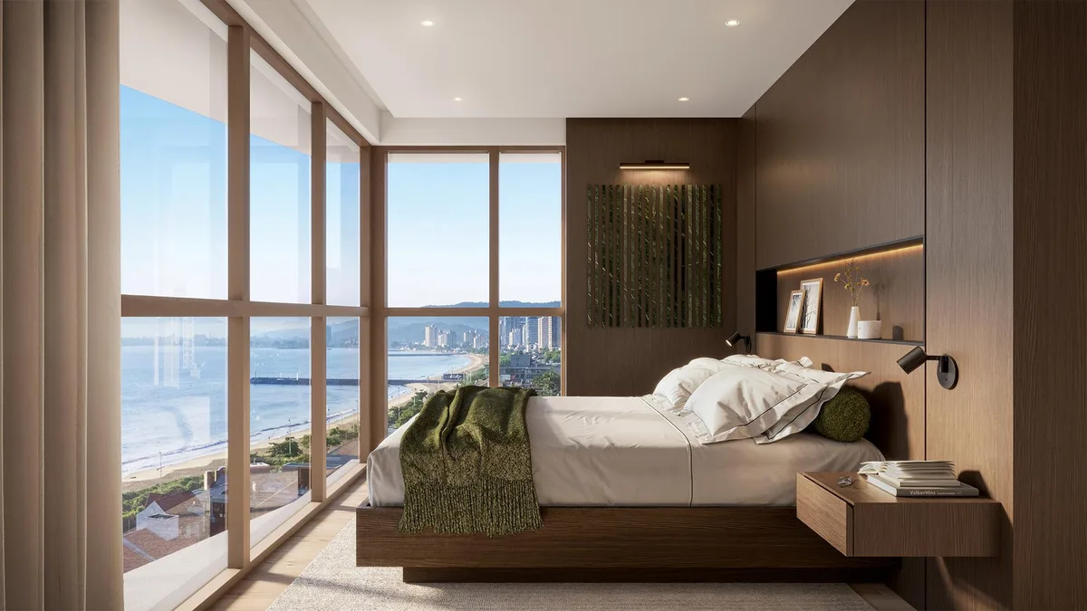 Quarto com vista para o mar e varanda, cama arrumada e decoração moderna - Apartamento 3 suítes em B